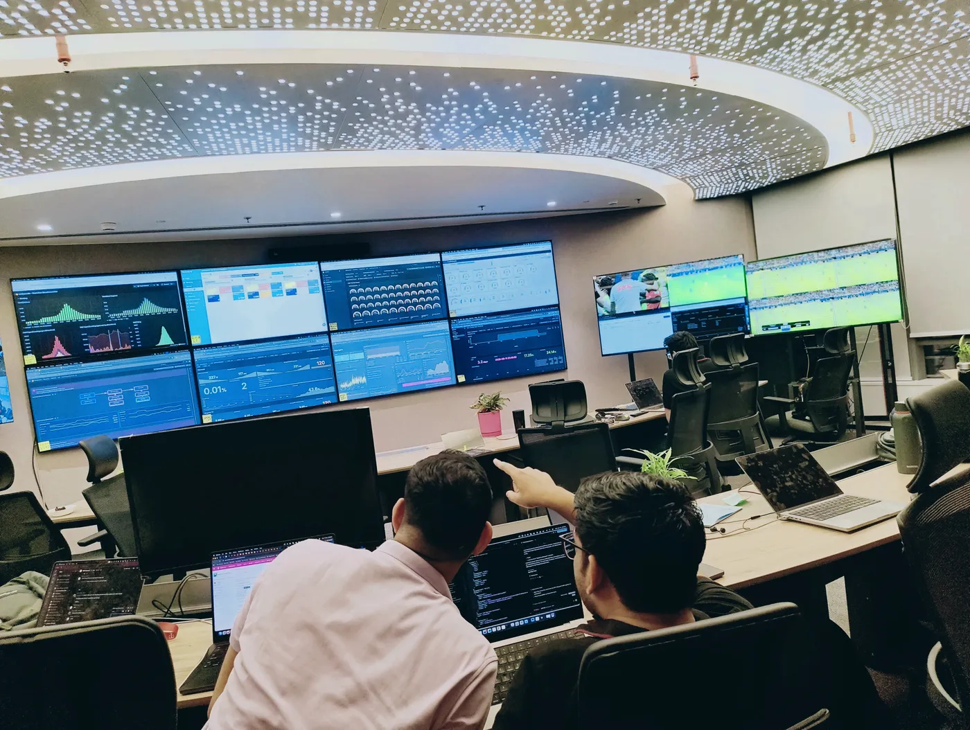 Engineers monitoring dashboards in the operations room during the FIFA World Cup