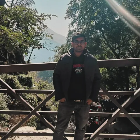 Standing on a bridge in the mountains